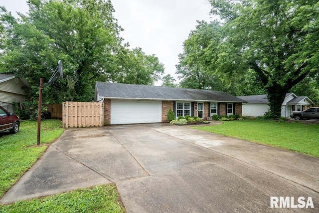1413 Sebring Way, Carbondale, IL 62901 - ranch-style house featuring brick siding, an attached garage, and concrete driveway