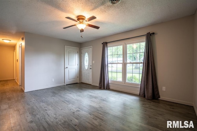 1413 Sebring Way, Carbondale, IL 62901 - unfurnished room with a ceiling fan, wood finished floors, and a textured ceiling