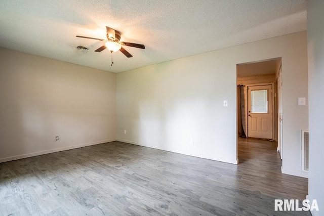 1413 Sebring Way, Carbondale, IL 62901 - spare room with ceiling fan, wood finished floors, and a textured ceiling