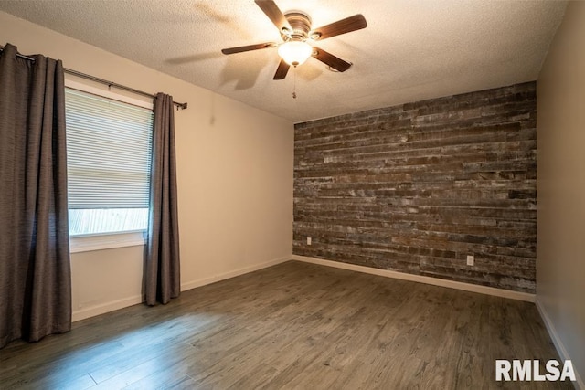 1413 Sebring Way, Carbondale, IL 62901 - unfurnished room with wood walls, wood finished floors, a textured ceiling, and ceiling fan