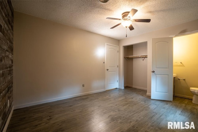 1413 Sebring Way, Carbondale, IL 62901 - unfurnished bedroom featuring wood finished floors, a textured ceiling, a closet, and ceiling fan