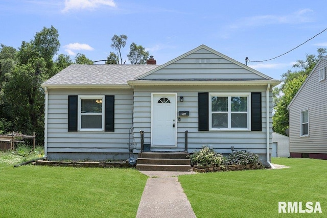 516 19th Ave, Rock Island, IL 61201 - bungalow-style house featuring a front lawn and a chimney