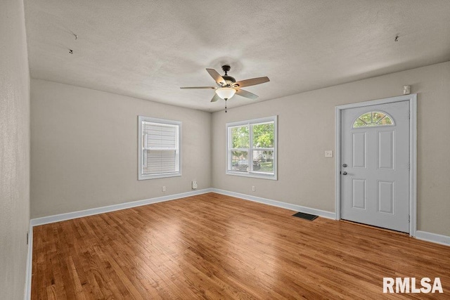 516 19th Ave, Rock Island, IL 61201 - entrance foyer featuring light wood-style flooring, a ceiling fan, and a textured ceiling