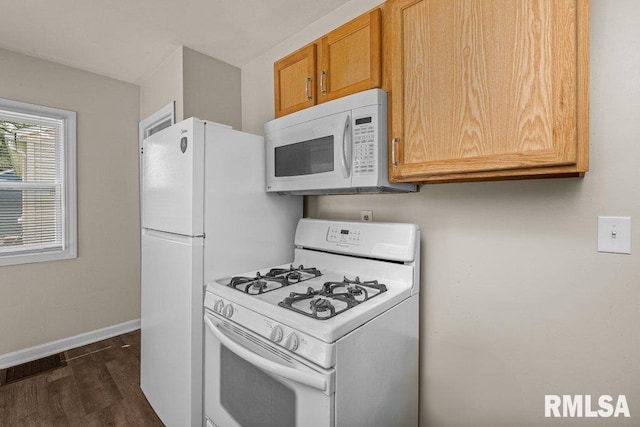 516 19th Ave, Rock Island, IL 61201 - kitchen with white appliances and dark wood-style flooring