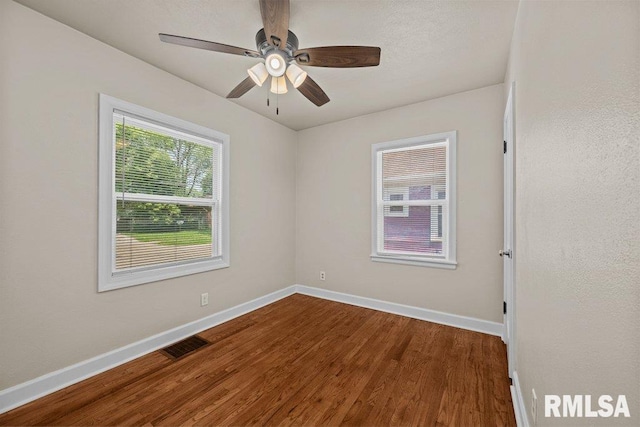 516 19th Ave, Rock Island, IL 61201 - spare room featuring wood finished floors and ceiling fan