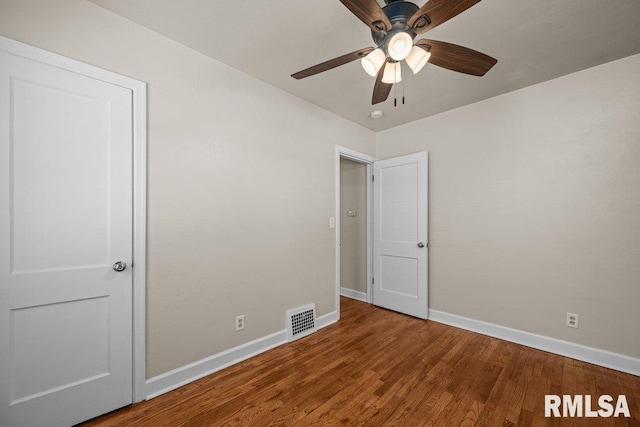 516 19th Ave, Rock Island, IL 61201 - unfurnished room featuring wood finished floors, ceiling fan, and a smoke detector