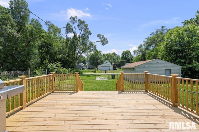 516 19th Ave, Rock Island, IL 61201 - deck featuring a yard, view of wooded area, and a detached garage