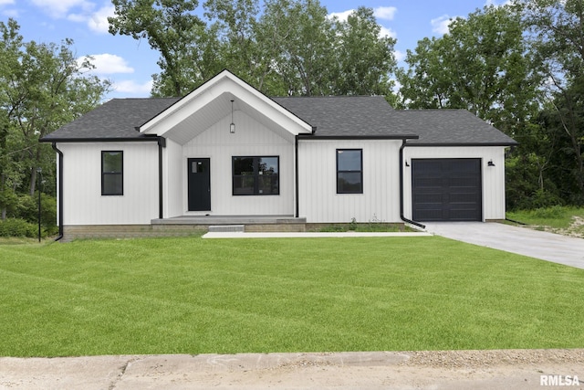 813 Williams Way, Carbon Cliff, IL 61239 - modern farmhouse with a front yard, driveway, a shingled roof, and a garage