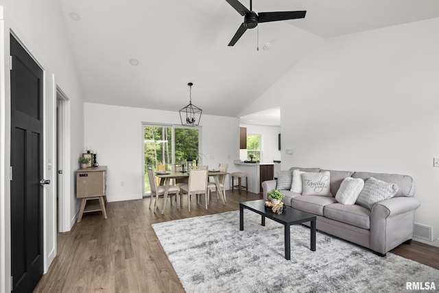 813 Williams Way, Carbon Cliff, IL 61239 - living area with high vaulted ceiling, a ceiling fan, and wood finished floors
