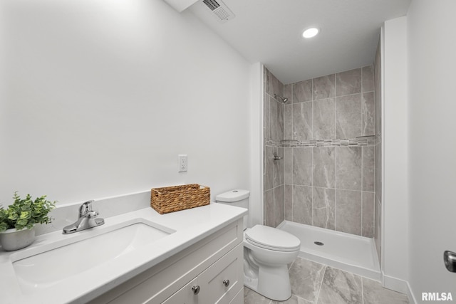 813 Williams Way, Carbon Cliff, IL 61239 - bathroom featuring a tile shower, vanity, marble finish flooring, and recessed lighting