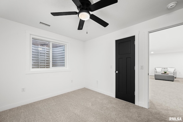 813 Williams Way, Carbon Cliff, IL 61239 - unfurnished room with carpet floors, a smoke detector, and ceiling fan
