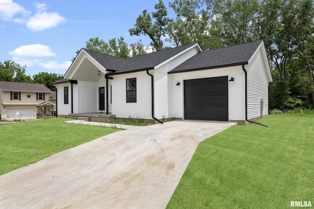 813 Williams Way, Carbon Cliff, IL 61239 - modern farmhouse featuring an attached garage, driveway, and a front yard