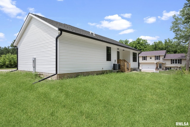 813 Williams Way, Carbon Cliff, IL 61239 - back of house with a lawn and roof with shingles