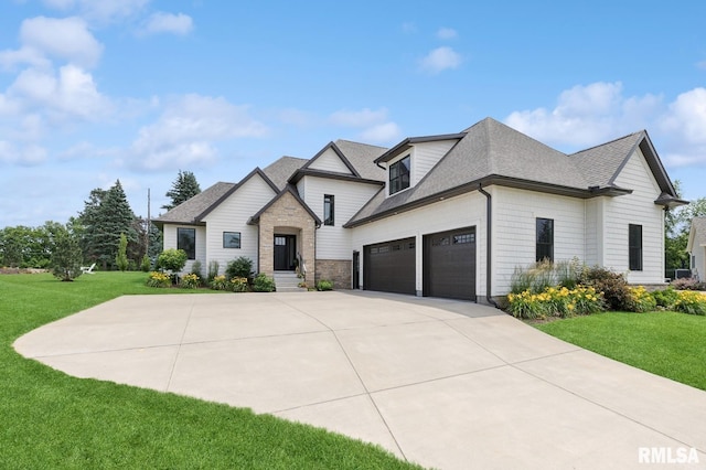 6925 Grover Sta, Bettendorf, IA 52722 - view of front of house with an attached garage, a shingled roof, driveway, and a front yard