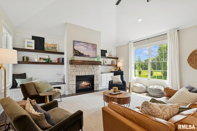 6925 Grover Sta, Bettendorf, IA 52722 - living area with high vaulted ceiling and a stone fireplace