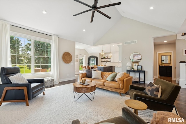 6925 Grover Sta, Bettendorf, IA 52722 - living room featuring a ceiling fan, wood finished floors, recessed lighting, plenty of natural light, and high vaulted ceiling