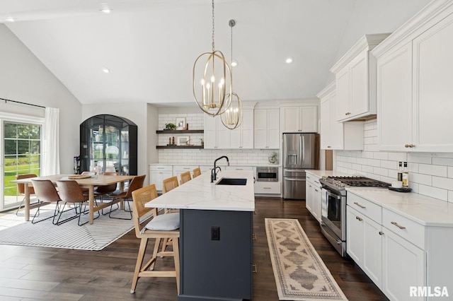 6925 Grover Sta, Bettendorf, IA 52722 - kitchen with stainless steel appliances, arched walkways, open shelves, decorative backsplash, and high vaulted ceiling