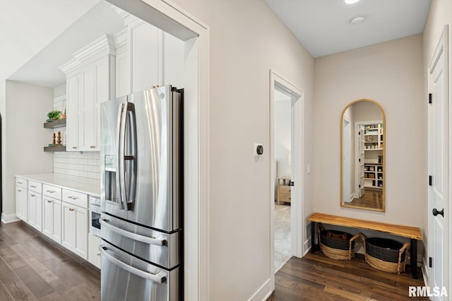 6925 Grover Sta, Bettendorf, IA 52722 - kitchen with stainless steel fridge, dark wood finished floors, open shelves, backsplash, and white cabinetry