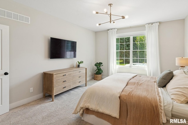 6925 Grover Sta, Bettendorf, IA 52722 - bedroom with light carpet and a chandelier