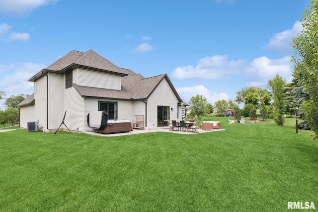 6925 Grover Sta, Bettendorf, IA 52722 - back of property with a hot tub, a patio area, a yard, and a shingled roof