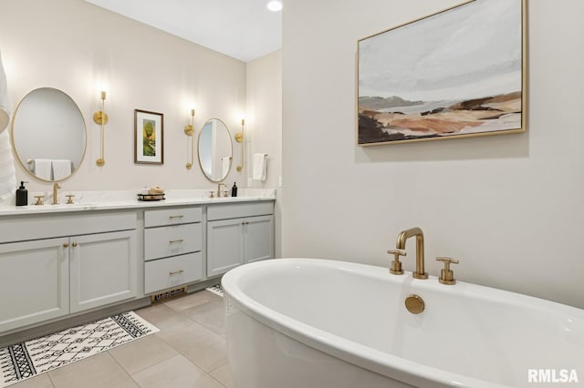 6925 Grover Sta, Bettendorf, IA 52722 - full bathroom with double vanity, a soaking tub, and tile patterned floors
