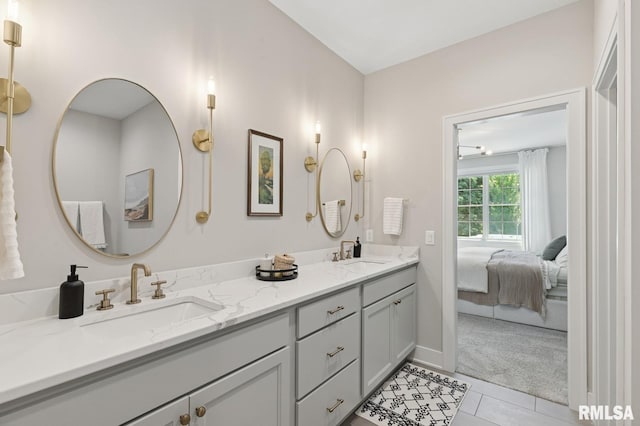 6925 Grover Sta, Bettendorf, IA 52722 - bathroom featuring double vanity, tile patterned floors, and ensuite bathroom