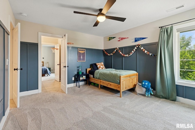 6925 Grover Sta, Bettendorf, IA 52722 - bedroom featuring carpet, multiple windows, and ceiling fan