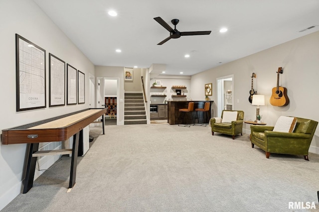 6925 Grover Sta, Bettendorf, IA 52722 - living area featuring carpet flooring, ceiling fan, stairway, and recessed lighting