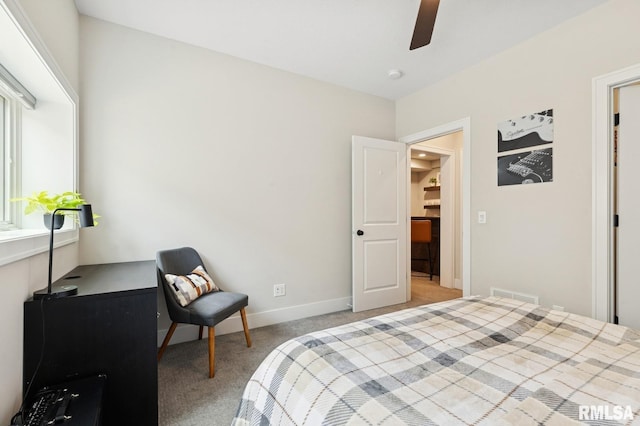 6925 Grover Sta, Bettendorf, IA 52722 - bedroom with light carpet and a ceiling fan