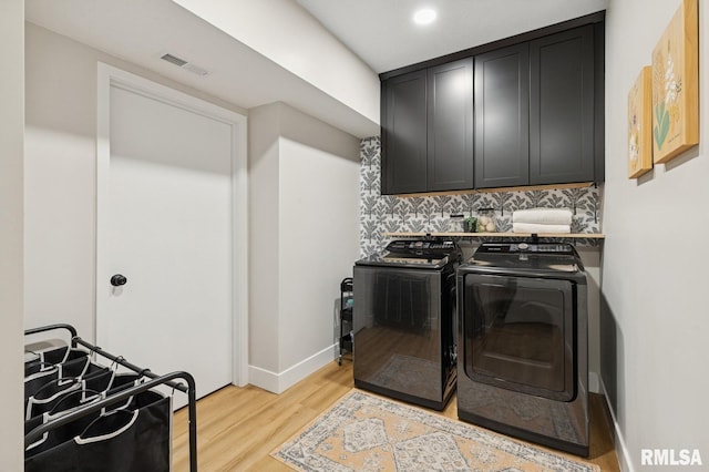 6925 Grover Sta, Bettendorf, IA 52722 - washroom featuring cabinet space, independent washer and dryer, light wood-type flooring, and recessed lighting