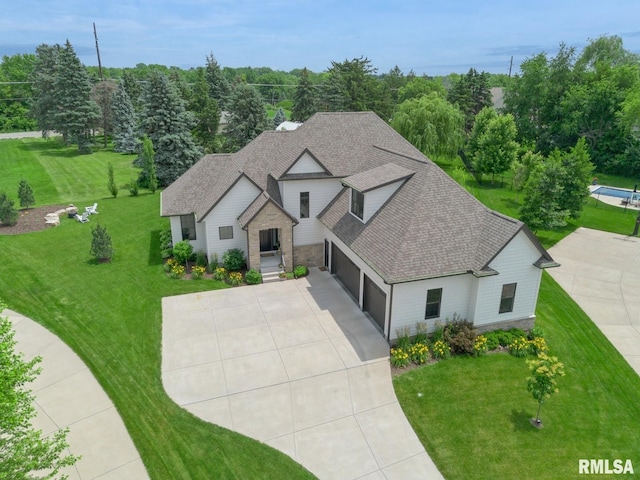 6925 Grover Sta, Bettendorf, IA 52722 - view of front of property with concrete driveway, an attached garage, roof with shingles, and a front yard