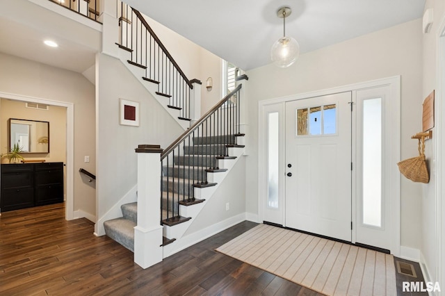 6925 Grover Sta, Bettendorf, IA 52722 - foyer entrance with dark wood-type flooring and stairs