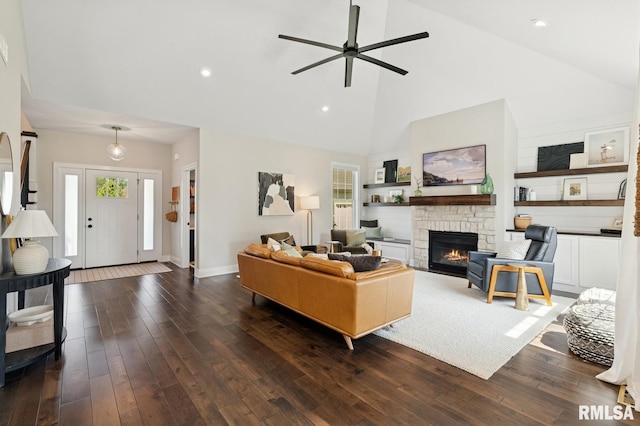 6925 Grover Sta, Bettendorf, IA 52722 - living area featuring high vaulted ceiling, a ceiling fan, dark wood-style floors, a stone fireplace, and recessed lighting
