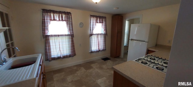 304 2nd St, Matherville, IL 61263 - kitchen with freestanding refrigerator, stovetop, and light countertops