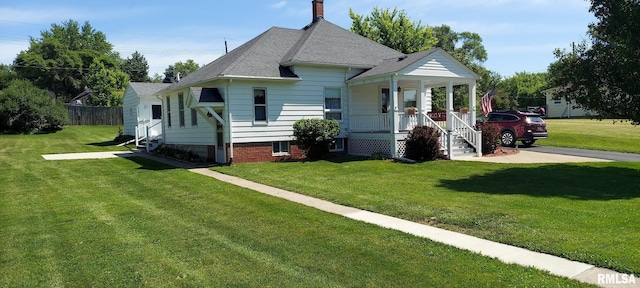 304 2nd St, Matherville, IL 61263 - view of front of property with a porch, a front yard, a chimney, and a shingled roof