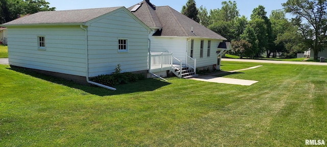 304 2nd St, Matherville, IL 61263 - view of property exterior featuring a lawn and roof with shingles