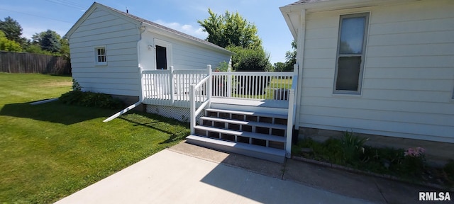 304 2nd St, Matherville, IL 61263 - view of exterior entry featuring a wooden deck and a patio area