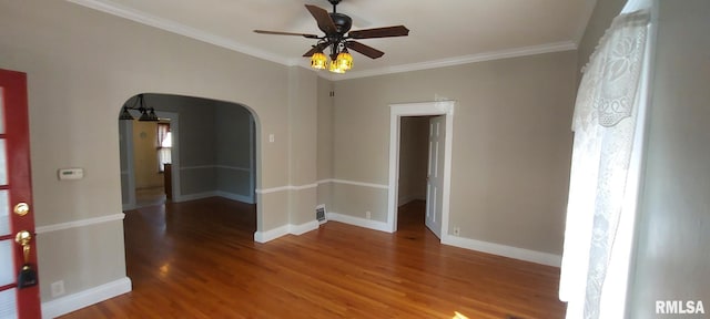 304 2nd St, Matherville, IL 61263 - empty room featuring wood finished floors, arched walkways, a ceiling fan, and crown molding