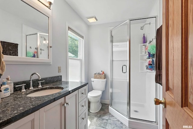 1020 Brown St, Bettendorf, IA 52722 - bathroom featuring a stall shower, vanity, and marble look tile flooring