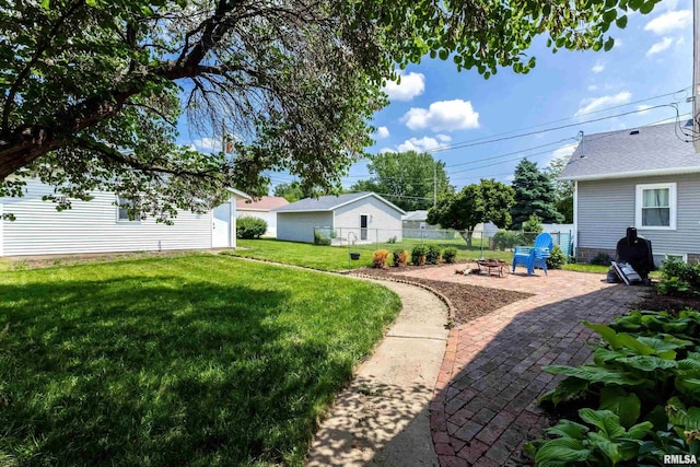 1020 Brown St, Bettendorf, IA 52722 - view of yard with an outdoor fire pit and a patio area