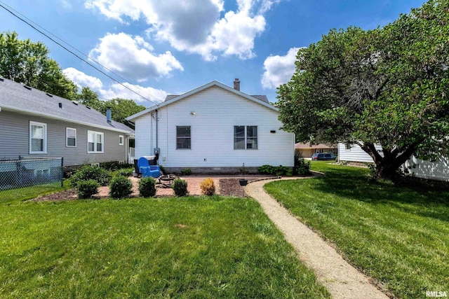 1020 Brown St, Bettendorf, IA 52722 - rear view of property featuring a chimney