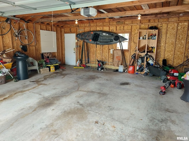 1020 Brown St, Bettendorf, IA 52722 - garage with a garage door opener and wooden walls