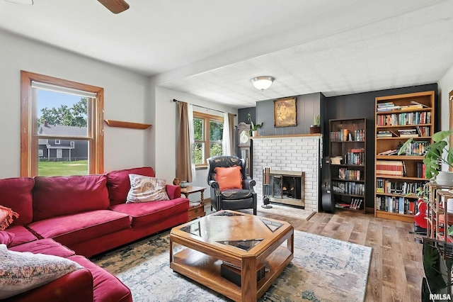 1020 Brown St, Bettendorf, IA 52722 - living room with a brick fireplace and wood finished floors