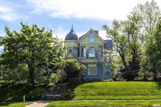 1703 20th St, Rock Island, IL 61201 - victorian-style house with stairs and a front yard