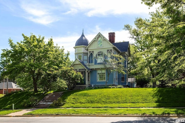 1703 20th St, Rock Island, IL 61201 - victorian home with a chimney, a front yard, and stairs