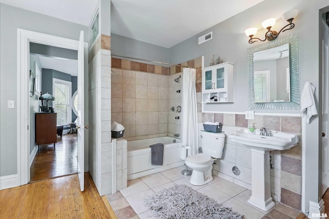 1703 20th St, Rock Island, IL 61201 - full bath with shower / bath combination with curtain, tile walls, and tile patterned flooring
