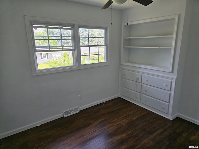 2505 Cody St, Bettendorf, IA 52722 - spare room with dark wood-type flooring and a ceiling fan