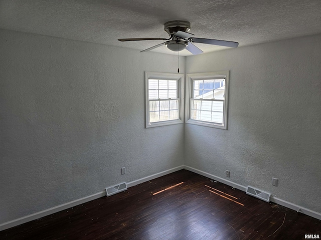 2505 Cody St, Bettendorf, IA 52722 - unfurnished room with wood finished floors, ceiling fan, a textured wall, and a textured ceiling