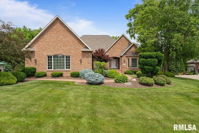 5985 Eagle Ridge Rd, Bettendorf, IA 52722 - traditional-style home featuring brick siding and a front lawn