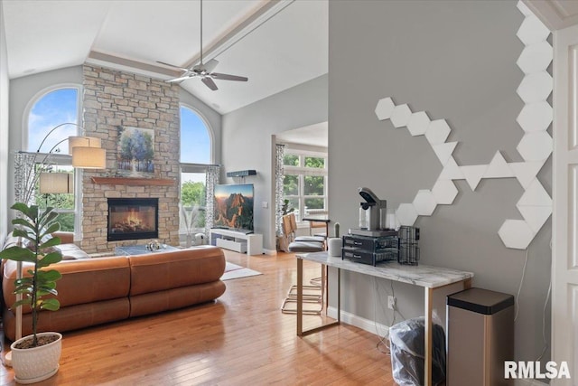 5985 Eagle Ridge Rd, Bettendorf, IA 52722 - living area with a ceiling fan, hardwood / wood-style floors, a fireplace, and high vaulted ceiling
